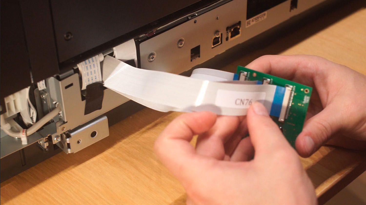 Plug the other ends of the ribbon cables (CN78, CN77, and CN76) into the corresponding cable ports